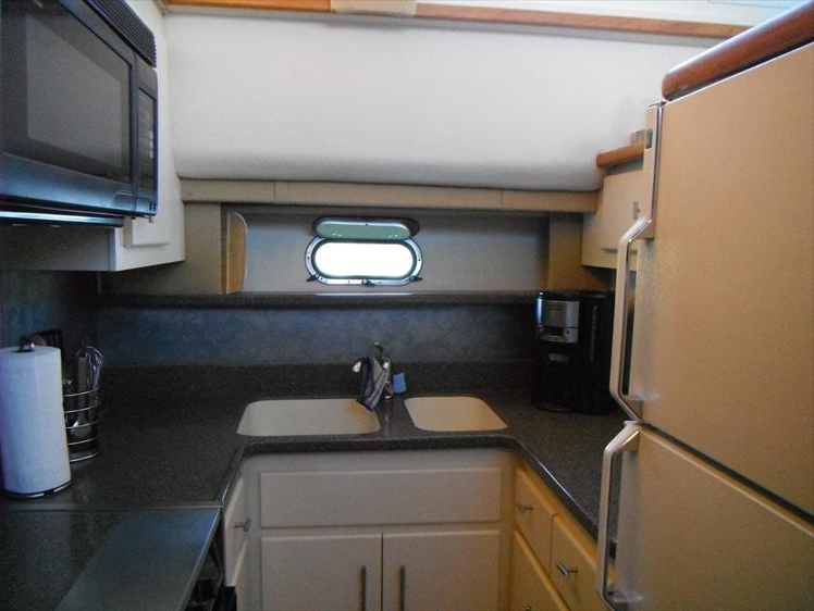 Galley of our boat showing how dark the counter and backsplash were.
