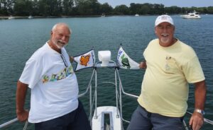 Michael and Loren showing off the burgees at our lunch stop in North Bay, Kelleys Island, Ohio.