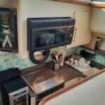 Painting of the backsplash brightens up the galley.